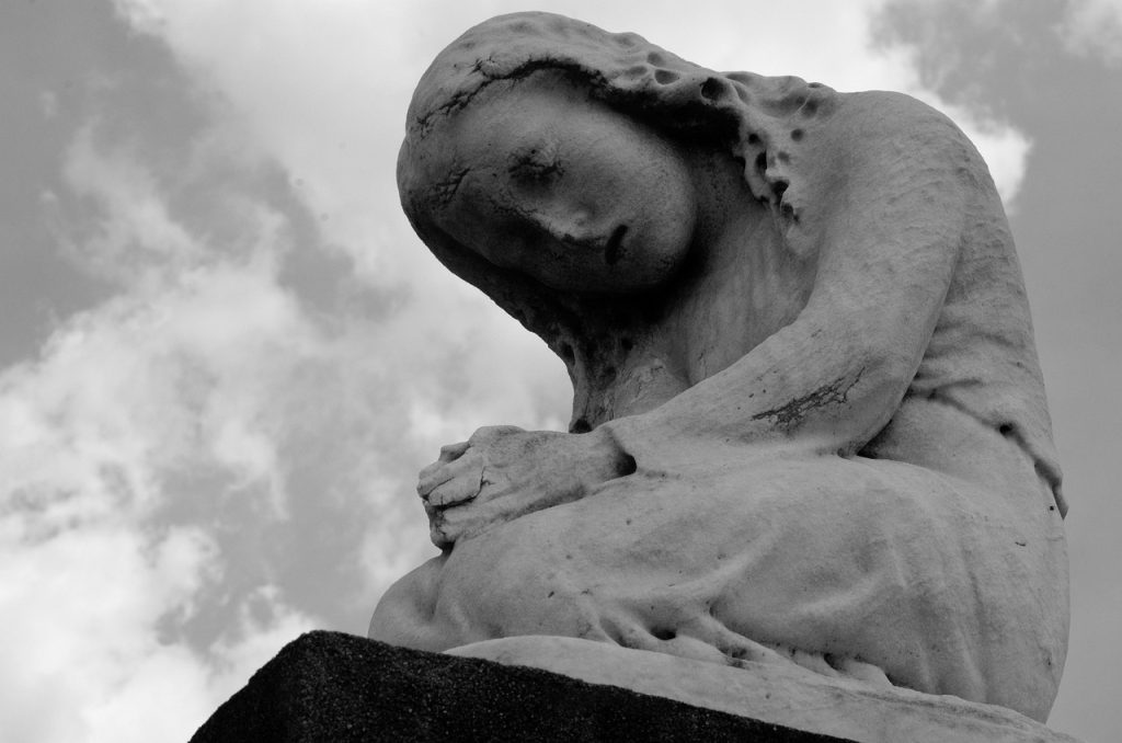 Statue, praying, kneeling — Harnessing the Power of Bscscan for Crypto Enthusiasts